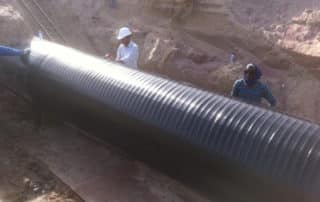 Men Applying PE Outer Wrap Corrosion Protection