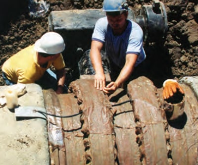 Men Working on Pipe